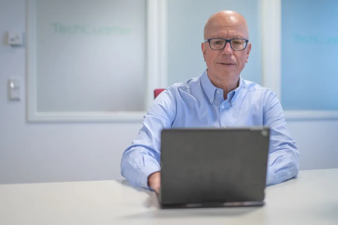 The CEO of LegalTegrity at his laptop, cover of his newsletter